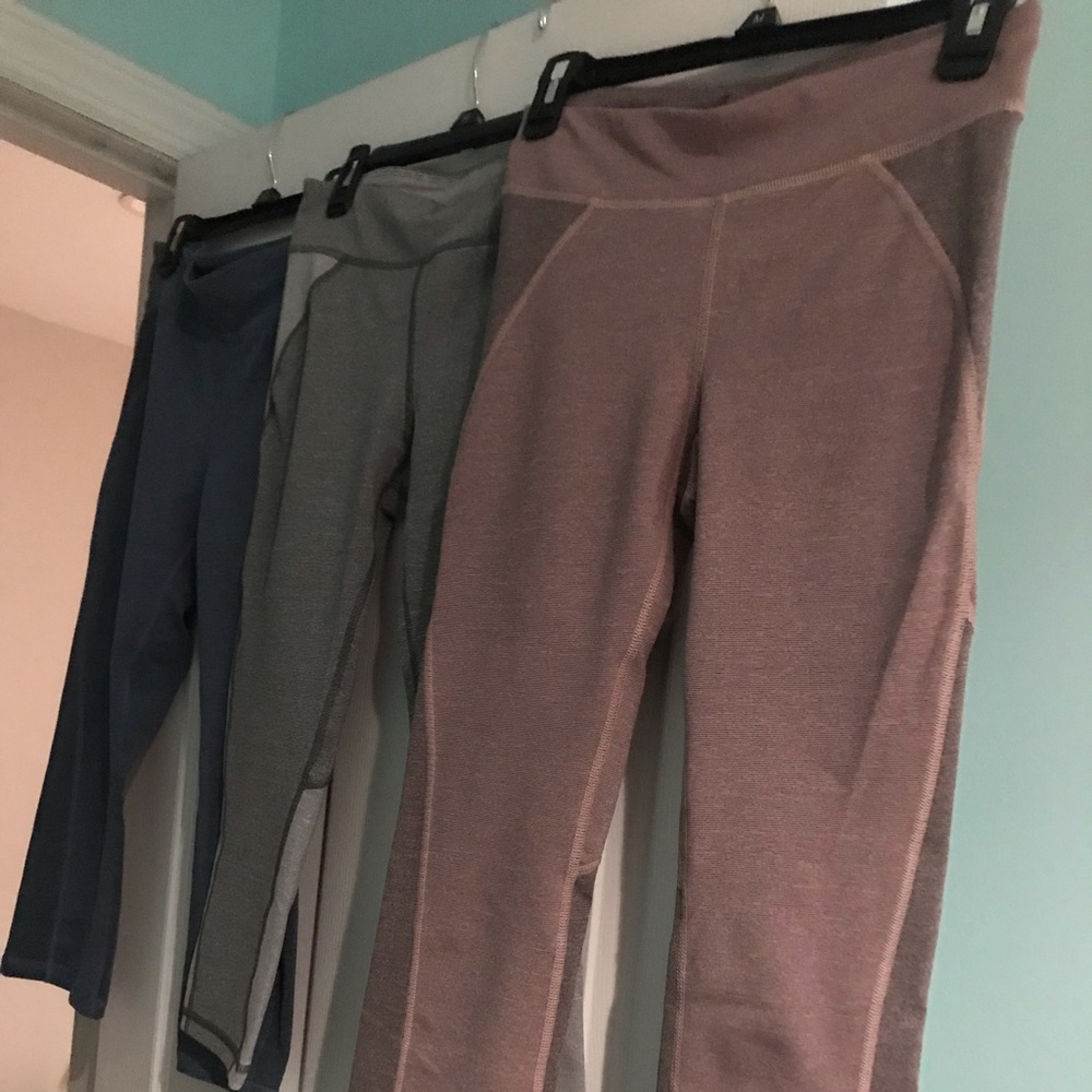 Three pairs of activewear cropped pants